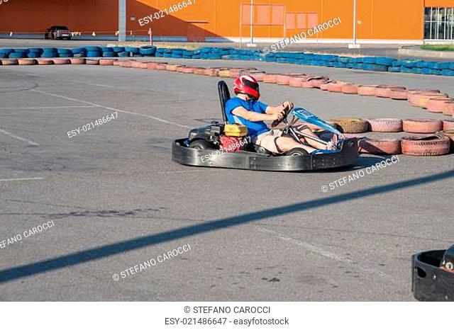 Man driving fast a Kart in a circuit lap in Kharkiv