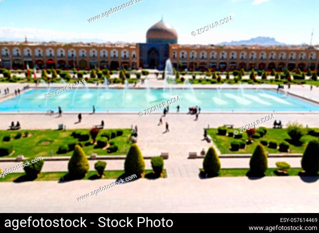 blur in iran  the old square of isfahan prople garden tree heritage tourism and mosque