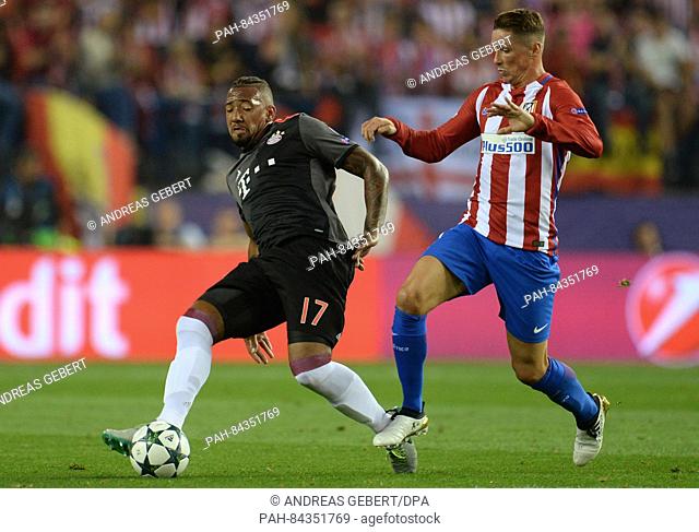 Munich's Jerome Boateng (l) and Atletico's Fernando Torres (r) in action during the Champions League Group D soccer match between Atletico Madrid and Bayern...