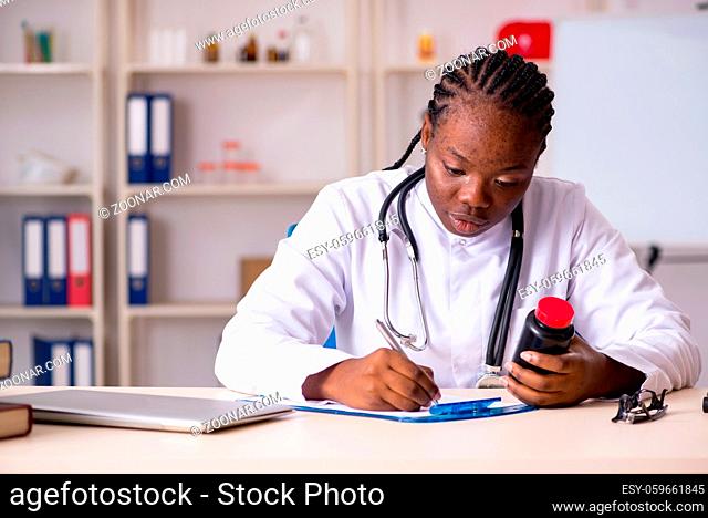 Black female doctor working at clinic