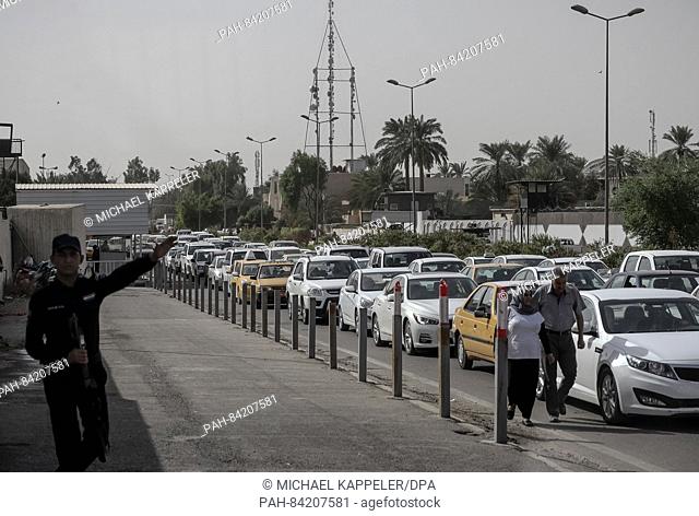 Commuter traffic backs up on the edge of the Green Zone in Baghdad, Iraq, 22 September 2016. The central government buildings, several embassies