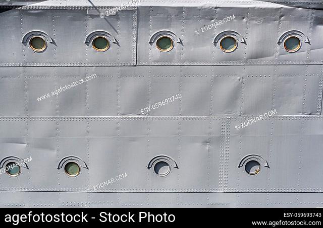 Side of distroyer ORP Blyskawica (Lightning), with rows of portholes as background with copy space. Blyskawica served in the Polish Navy during World War II is...