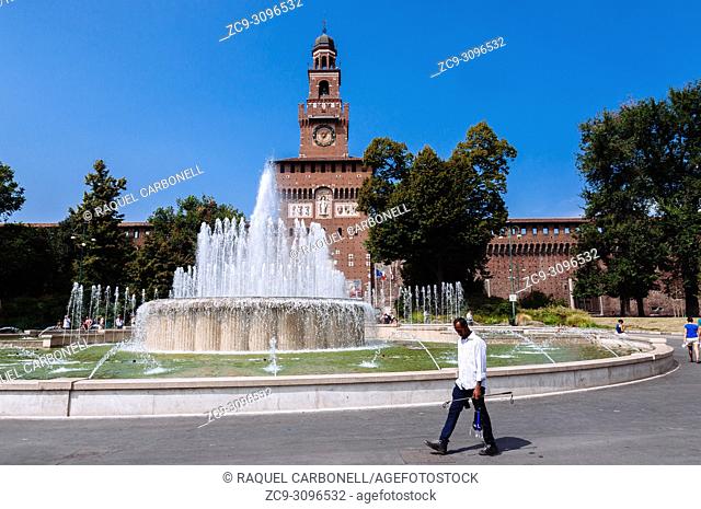 Piazza Castello square fountain with the Torre del Filarete in Sforza Castle at back, Milan, Lombardy, Italy