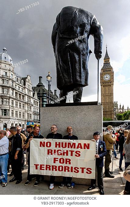 British Army Veterans Standing Under The Statue Of Winston Churchill Hold A Banner Demanding 'No Human Rights For Terrorists' , Parliament Square, London, UK