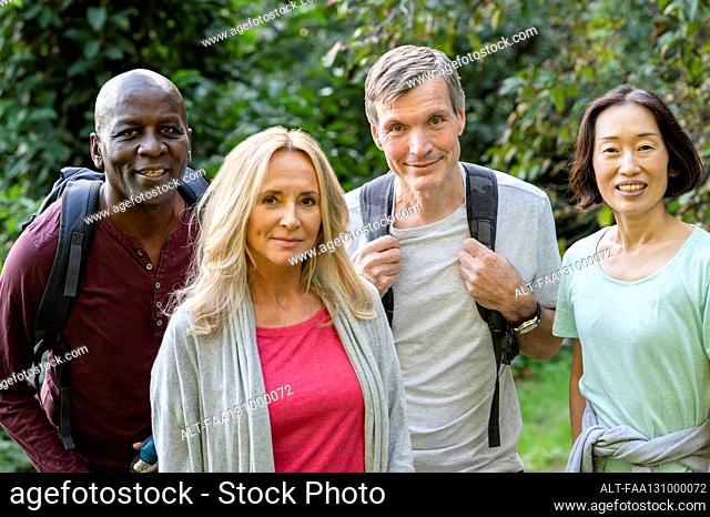 Diverse group of middle-aged friends having a good time outdoors