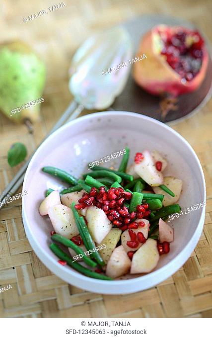 Bean salad with pears and pomegranate seeds