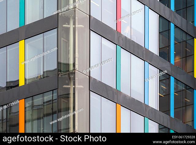 Brussels Capital Region, Belgium Abstract colorful windows of a contemporary office building at the Arts Loi cross
