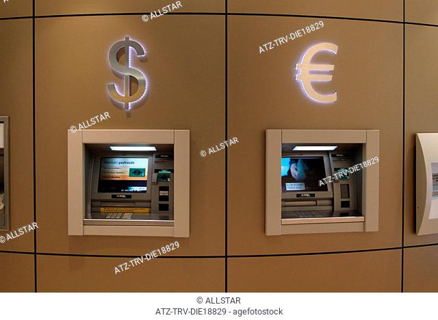 CASH DISPENSING MACHINES & DOLLAR, EURO LOGO; SCHIPHOL AIRPORT, AMSTERDAM, HOLLAND; 24/11/2011
