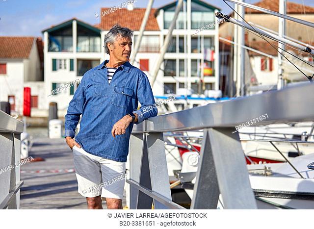 Man in the harbor, Port De Plaisance Larraldenia, Ciboure, Aquitaine, Basque Country, France