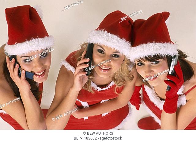 Three girls wearing christmas disguise