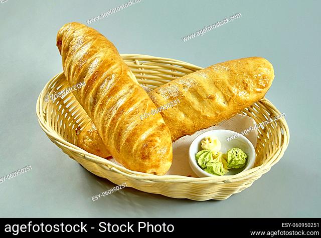 Bread in a basket isolated over white