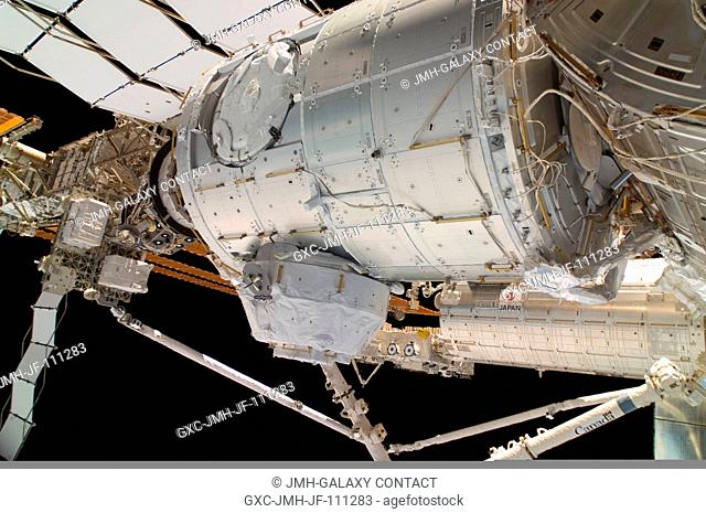 In the grasp of the Canadarm2, the Pressurized Mating Adapter 3 (PMA-3) is relocated from the Harmony node to the open port on the end of the newly-installed...