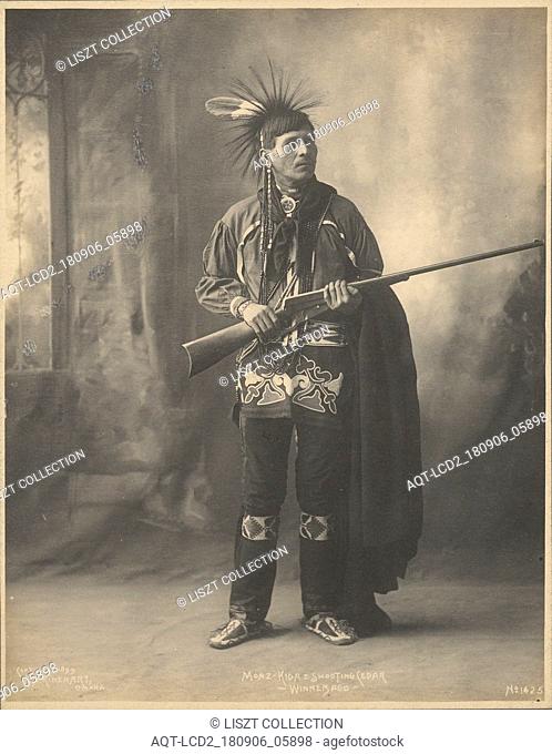 Moaz-Kida= Shooting Cedar, Winnebago; Adolph F. Muhr (American, died 1913), Frank A. Rinehart (American, 1861 - 1928); 1899; Platinum print; 23.7 x 18