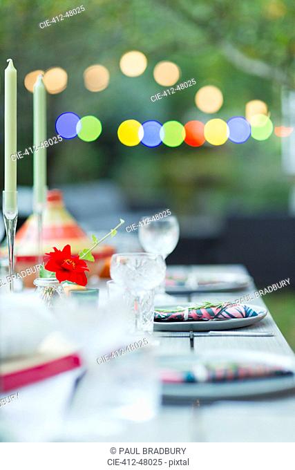Placesettings on dinner garden party table