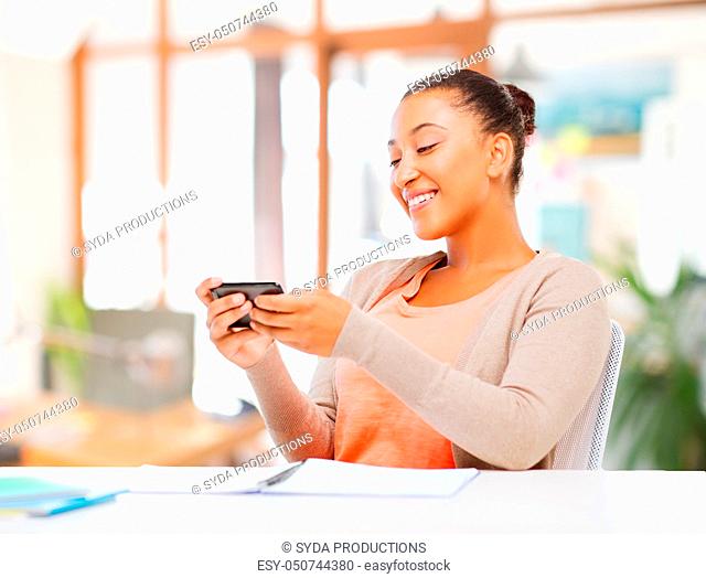 african american woman with smartphone