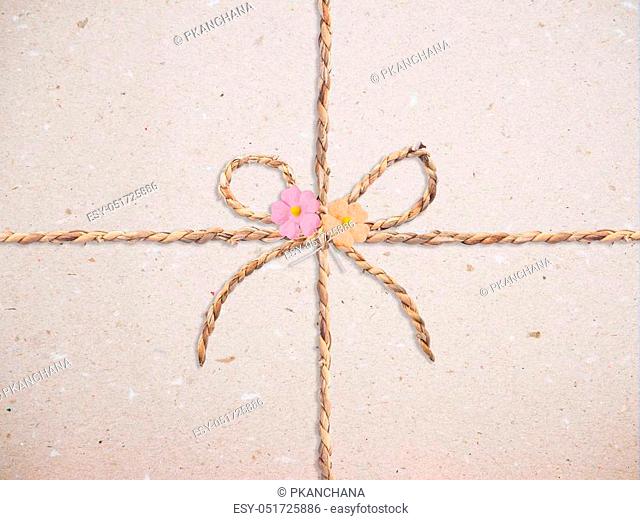 Close up recycled paper with bow and flower for textured and background