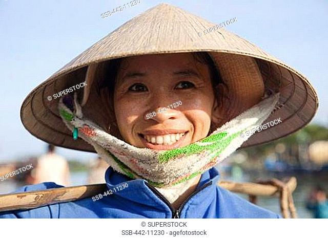Close-up of a female market vendor smiling, Hoi An, Vietnam