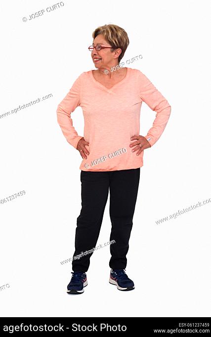full portrait of happy senior woman with sportswear looking side on white background