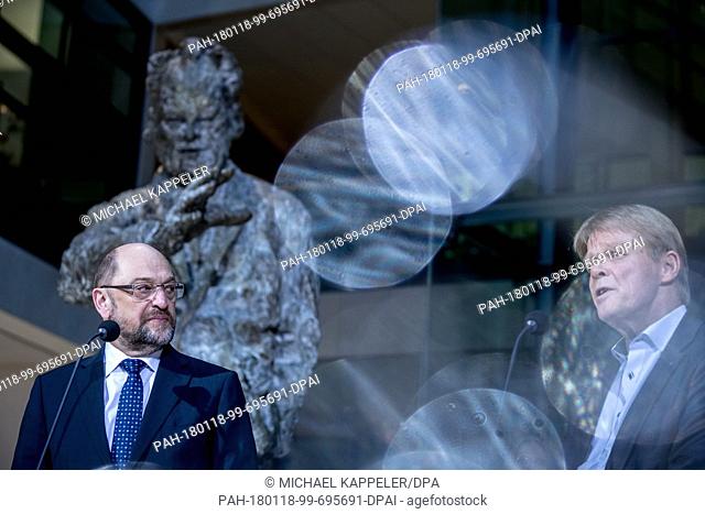 Martin Schulz, leader of the German Social Democratic Party, talks next to Reiner Hoffmann, chairman of the DGB, during a press conference at the SPD...