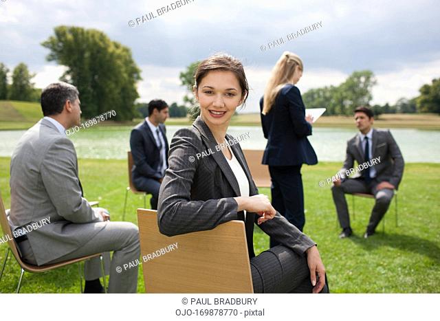 Business people having meeting outdoors