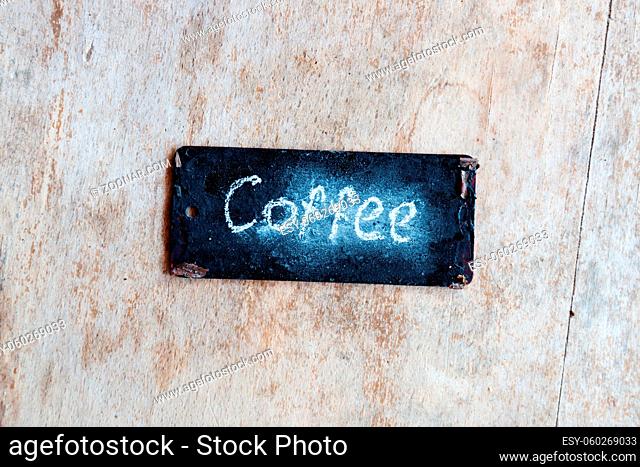 coffee sign, written in chalk, label on a wooden surface