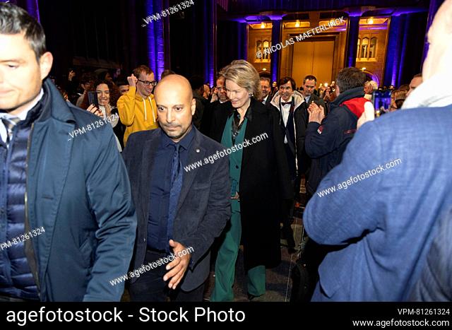 Queen Mathilde of Belgium and Walloon Minister President Elio Di Rupo arrive for a royal visit to the Invisible Youth European Summit (I-YES) organized by 'Une...