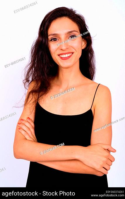 Studio shot of young beautiful woman against white background