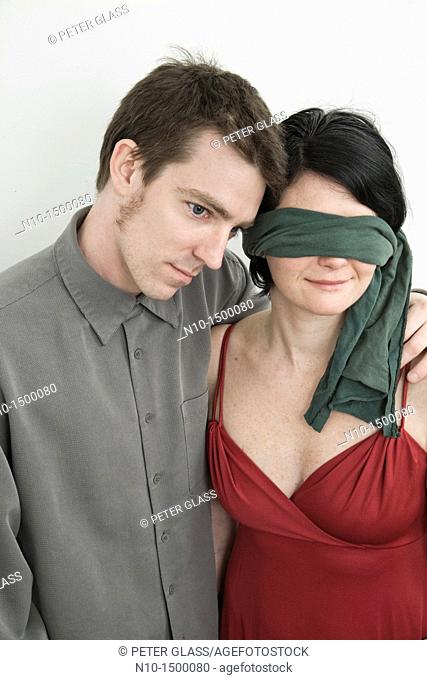 Husband and his blindfolded wife