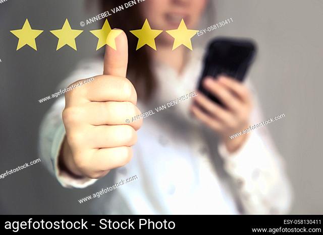 Customer Experience Concept. Woman hand showing on five star excellent rating on background, copy space Female with thumbs up, online rating