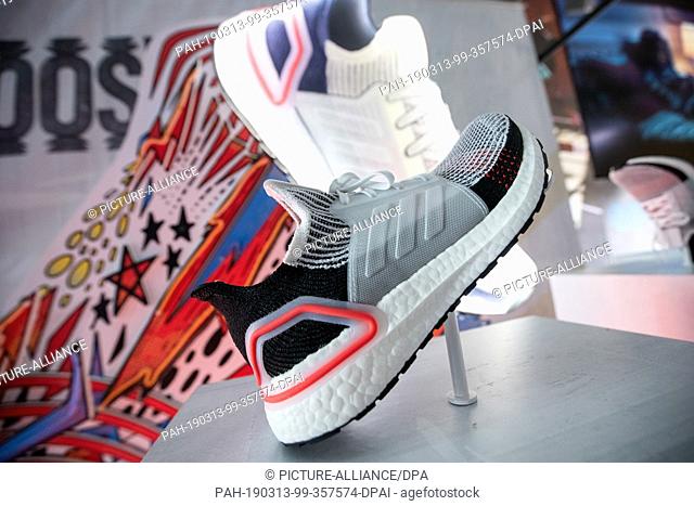 13 March 2019, Bavaria, Herzogenaurach: A shoe from the sporting goods manufacturer adidas is on display in a showroom prior to the start of the adidas AG...