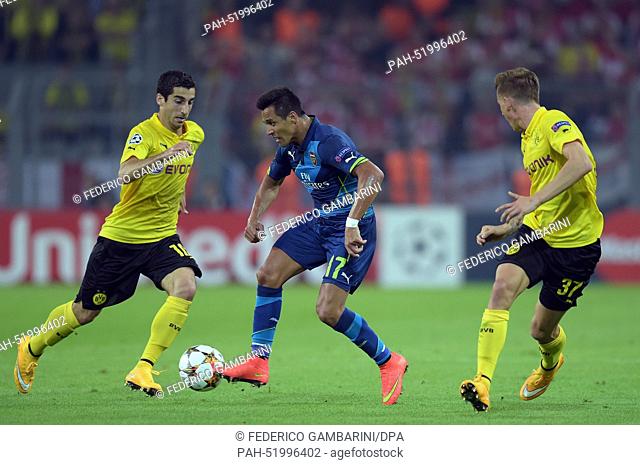 Dortmund's Henrikh Mkhitaryan (L) and Arsenal's Alexis Sanchez vie for the ball during the Champions League group D match between Borussia Dortmund and FC...