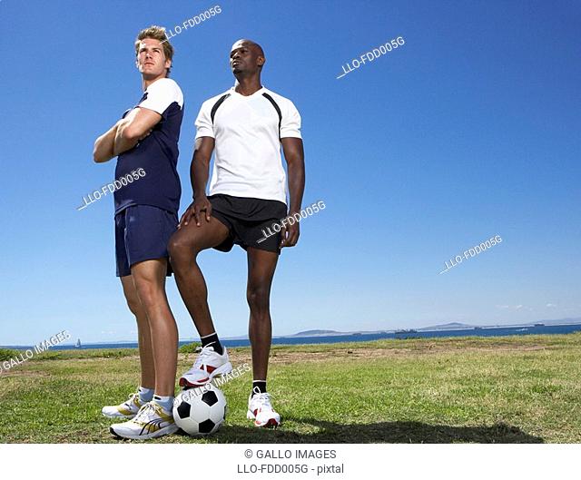 Two Men Standing Side by Side with a Soccer Ball  Cape Town, Western Cape Province, South Africa