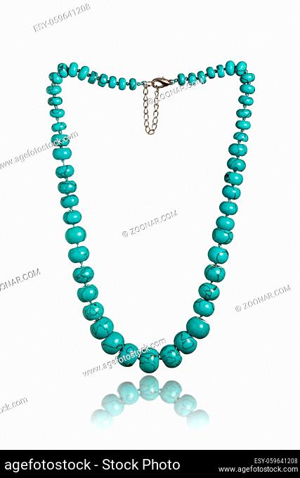 Turquoise necklace isolated on white background. Beads with natural stone turquoise close-up jewelry