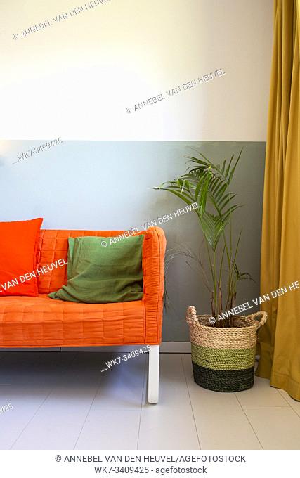 modern room with yellow curtains and orange sofa, colorful Scandinavian design retro