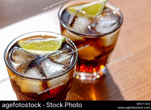 Rum. Cola Cuba Libre with Lime and Ice. Top view