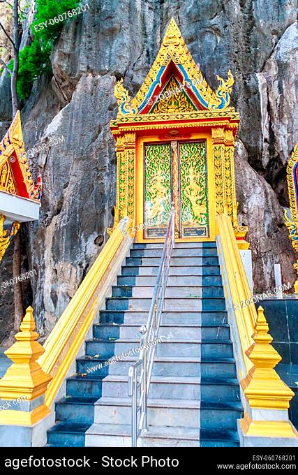 Beautiful entrance gate to the cave in Thai temple on the rock mountain