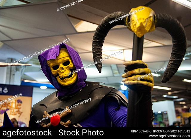 A fan of He-Man poses for a photo using a costume of Skeletor during the fourth day of the SOFA (Salon del Ocio y la Fantasia) 2021
