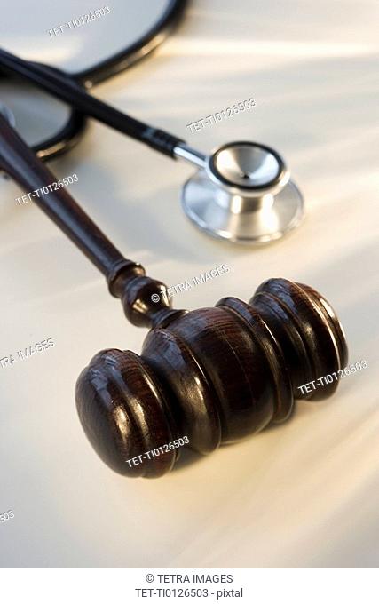 Judge’s gavel next to stethoscope