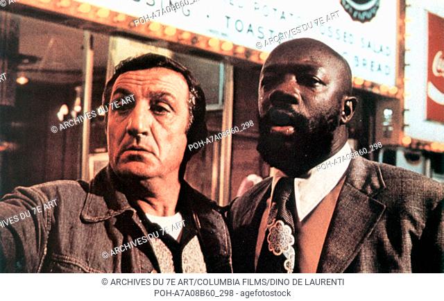Uomini duri  Tough Guys Year: 1974 - Italy Lino Ventura, Isaac Hayes  Director: Duccio Tessari. It is forbidden to reproduce the photograph out of context of...
