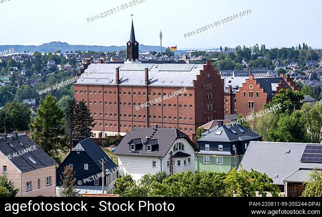 11 August 2022, Saxony, Stollberg: Hoheneck Castle towers prominently among the roofs of the town of Stollberg. It was once home to the largest women's prison...