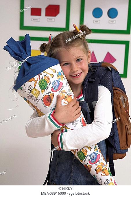 Date of first school day, classroom, child, girls, school satchels, school bag, hold, smile, cheerful, with pride, half mirror image