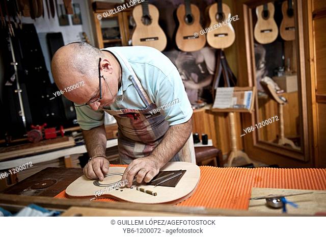 Master Luthier Guitar-Maker in his workshop in the process of making a classical Spanish guitar  Barcelona  SPAIN
