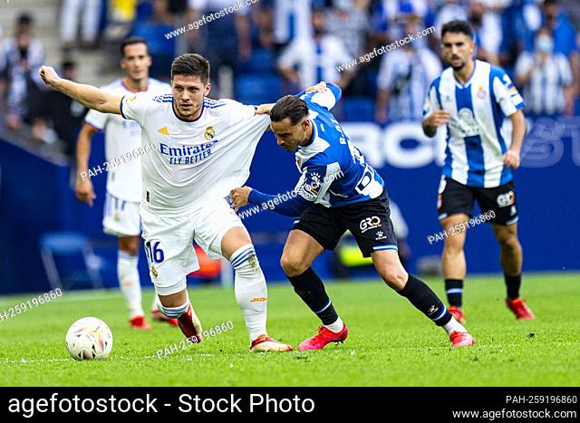 Jovic (Real Madrid CF) duels for the ball against Raul de Tomas (RCD Espanyol), during La Liga soccer match between RCD Espanyol and Real Madrid CF