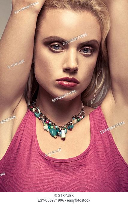Close up portrait of a beautiful blonde woman with a sultry look and sensual expression