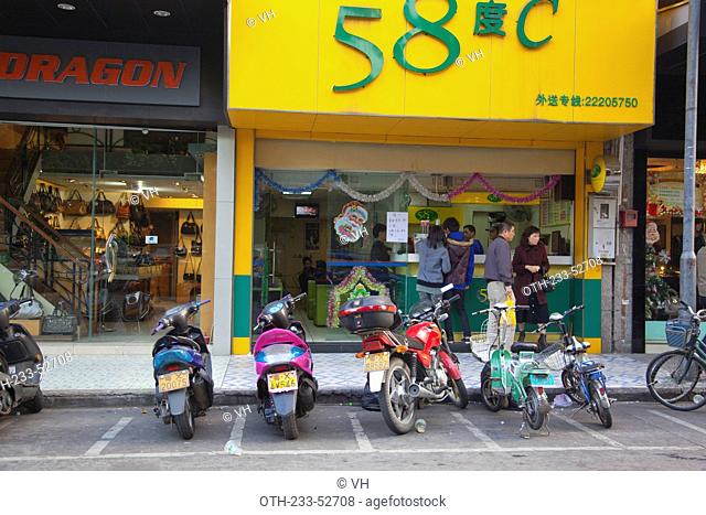 Shops with motorcycle parking at the foreground, Daliang, Shunde, Guangdong, China