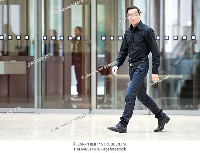Defendant Alexander N. leaves the courtroom at the regional court in Duesseldorf, Germany, 20 February 2014. He is on trial for throwing dog ""Kali"" out of the...
