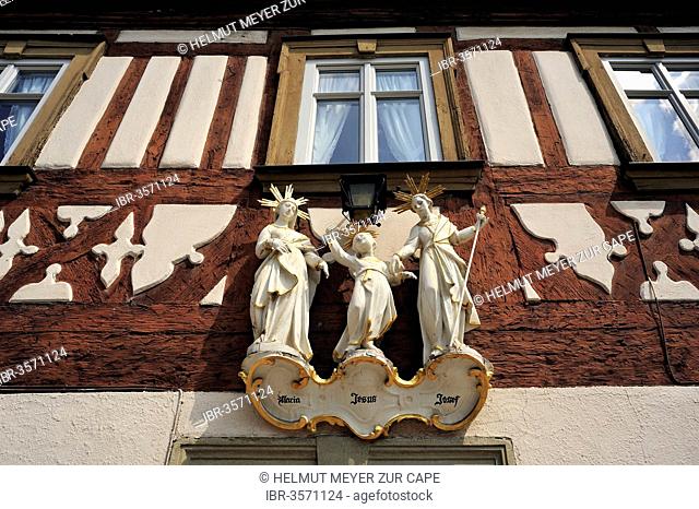 Statues of saints, the Holy Family, on a half-timbered house