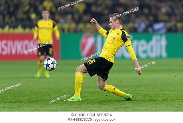 Dortmund's Lukasz Piszczek plays the ball during the UEFA Champions League round of 16 second-leg soccer match between Borussia Dortmund and S.L