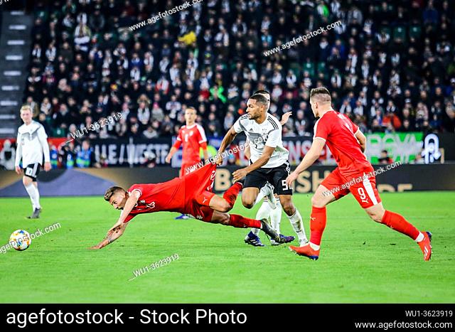 Wolfsburg, Germany, March 20, 2019: footballers Jonathan Tah (GER) and Sergej Milinkovic (SRB) in action during the international soccer game Germany vs Serbia...