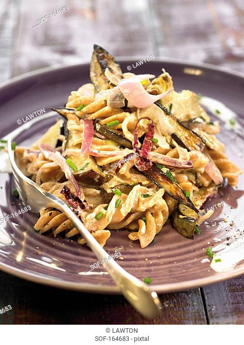 Spelt pasta sauteed with eggplants and artichokes